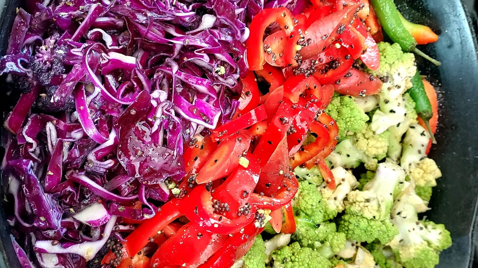 Shredded red cabbage, tomato, and cauliflower salad