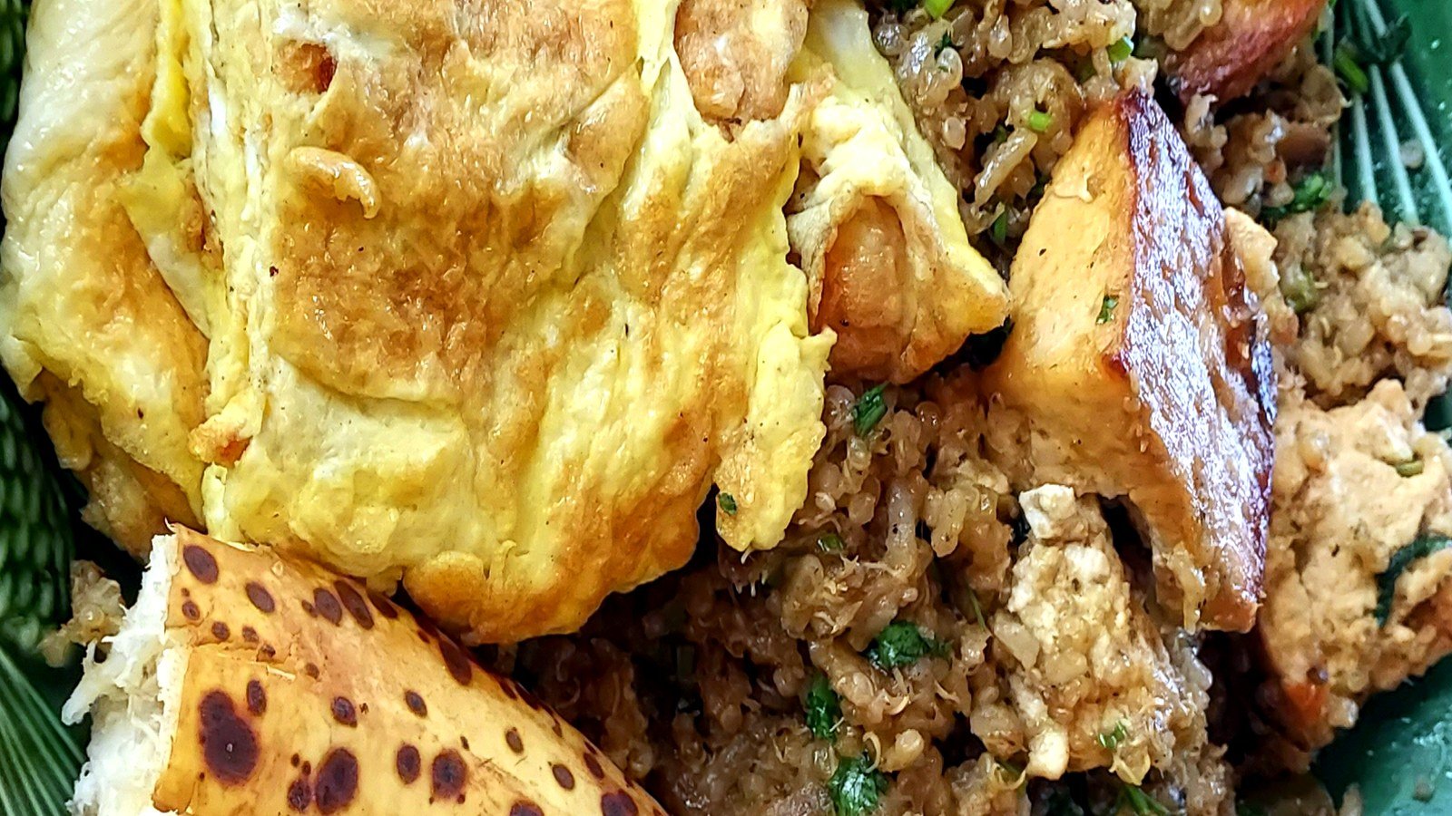 Herbed omelet with rice pilaf and roasted plantain